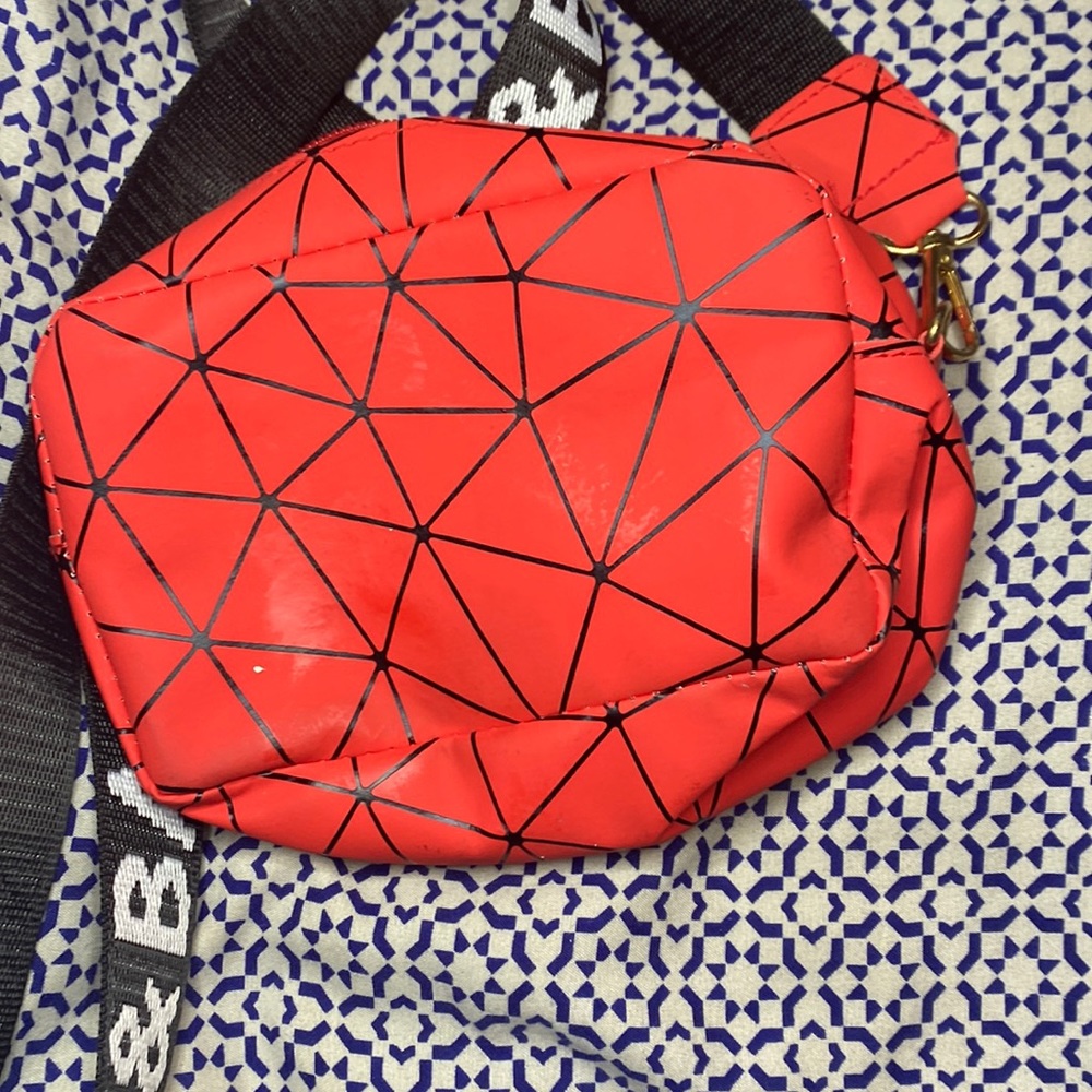This is a red cross body black designer purse from shein